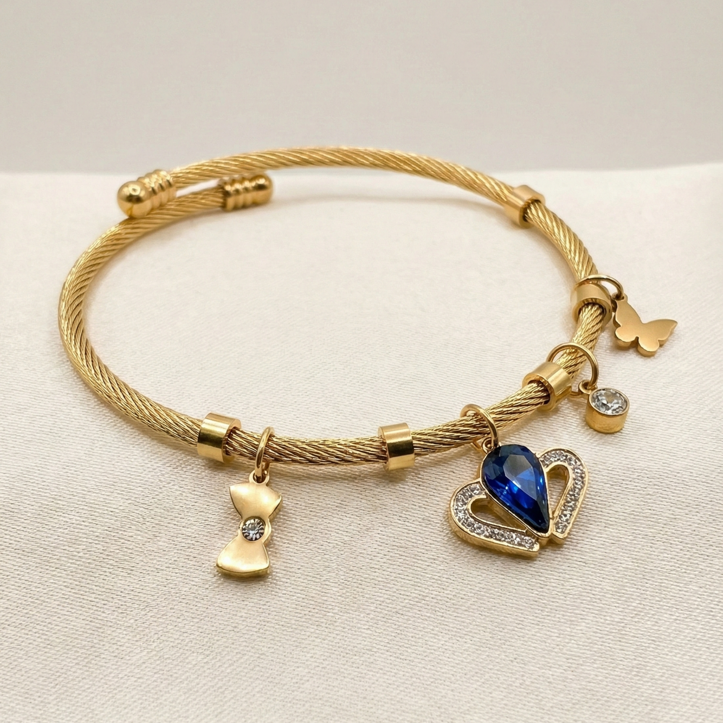 Gold-Plated Twisted Cable Charm Bracelet with Royal Blue Heart Pendant