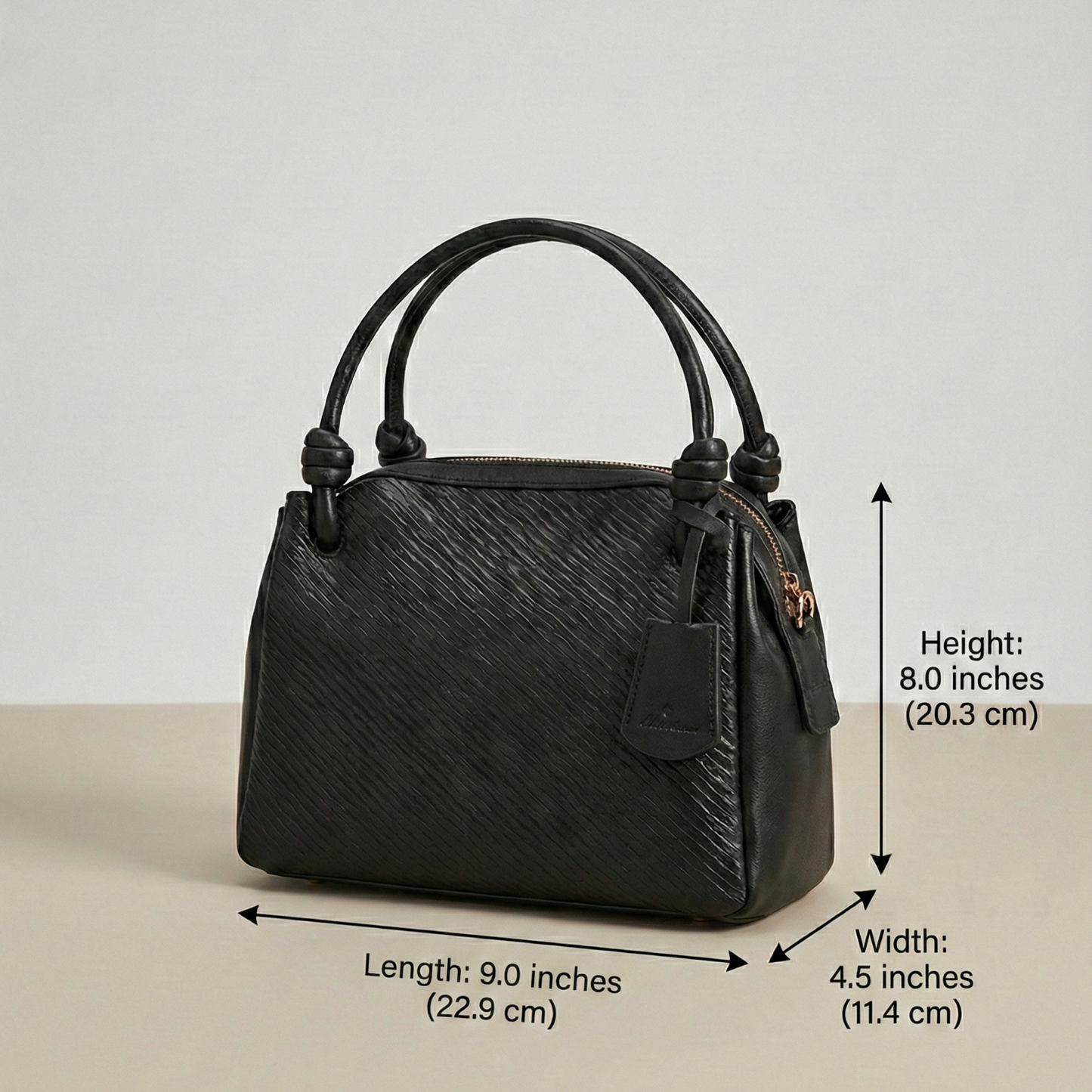 Black handbag with measurements on a light gray background Black Leather Satchel, Women's Office Bag, Textured Leather Handbag, Professional Work Bag for Women, Black Crossbody Bag, Designer Satchel with Sling, Executive Women's Bag, Knotted Handle Handbag, Formal Office Purse, Luxury Work Accessory