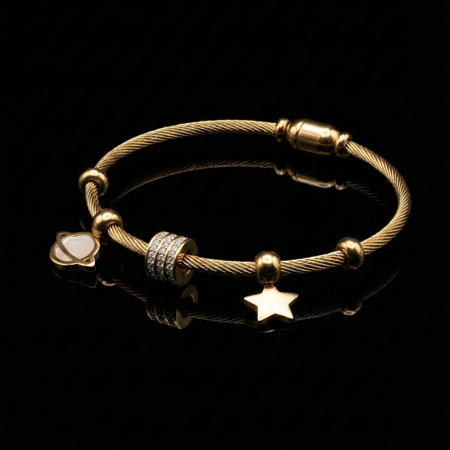 Gold-Tone Twisted Cable Bangle with Saturn & Star Charms