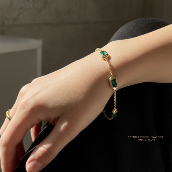 Gold bracelet with green gemstones on a wrist against a neutral background
Gold plated stainless steel bracelet
Non tarnish gold bracelet
Waterproof gold jewelry
Hypoallergenic gold bracelet
Emerald green stone bracelet
Stainless steel jewellery for women