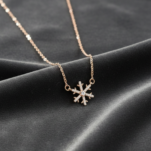 Gold necklace with a snowflake pendant on a dark fabric background Snowflake necklace, winter jewelry, crystal snowflake pendant, gold snowflake charm, Christmas jewelry gift, holiday pendant necklace, dainty winter accessory, stainless steel snowflake necklace, sparkling crystal jewelry.