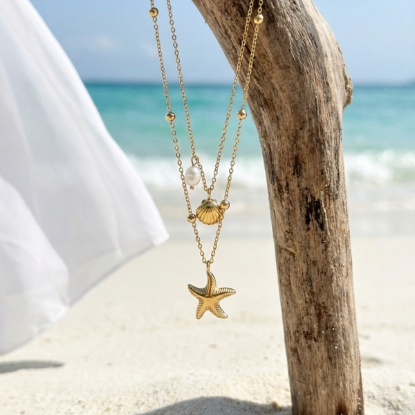 Gold necklace with starfish and shell pendant on a beach setting Layered gold necklace, starfish pendant jewelry, seashell charm necklace, beach wedding jewelry, coastal grandmother aesthetic, ocean-themed accessories, gold shell necklace for women, boho beach jewelry, summer vacation accessories, luxury beachwear jewelry.