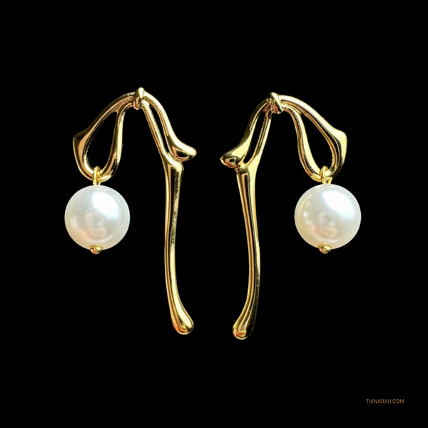 Gold earrings with pearl drops on a black background Liquid gold earrings, pearl drop earrings, abstract jewelry, molten metal earrings, sculptural earrings, statement earrings for women.