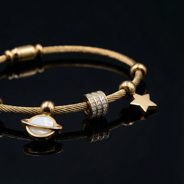 Celestial jewelry, Saturn charm bracelet, gold cable bangle, star charm jewelry, mother of pearl bracelet, cosmic themed accessories, stackable gold bangles, gift for her, astronomical jewelry, pavé charm bracelet.